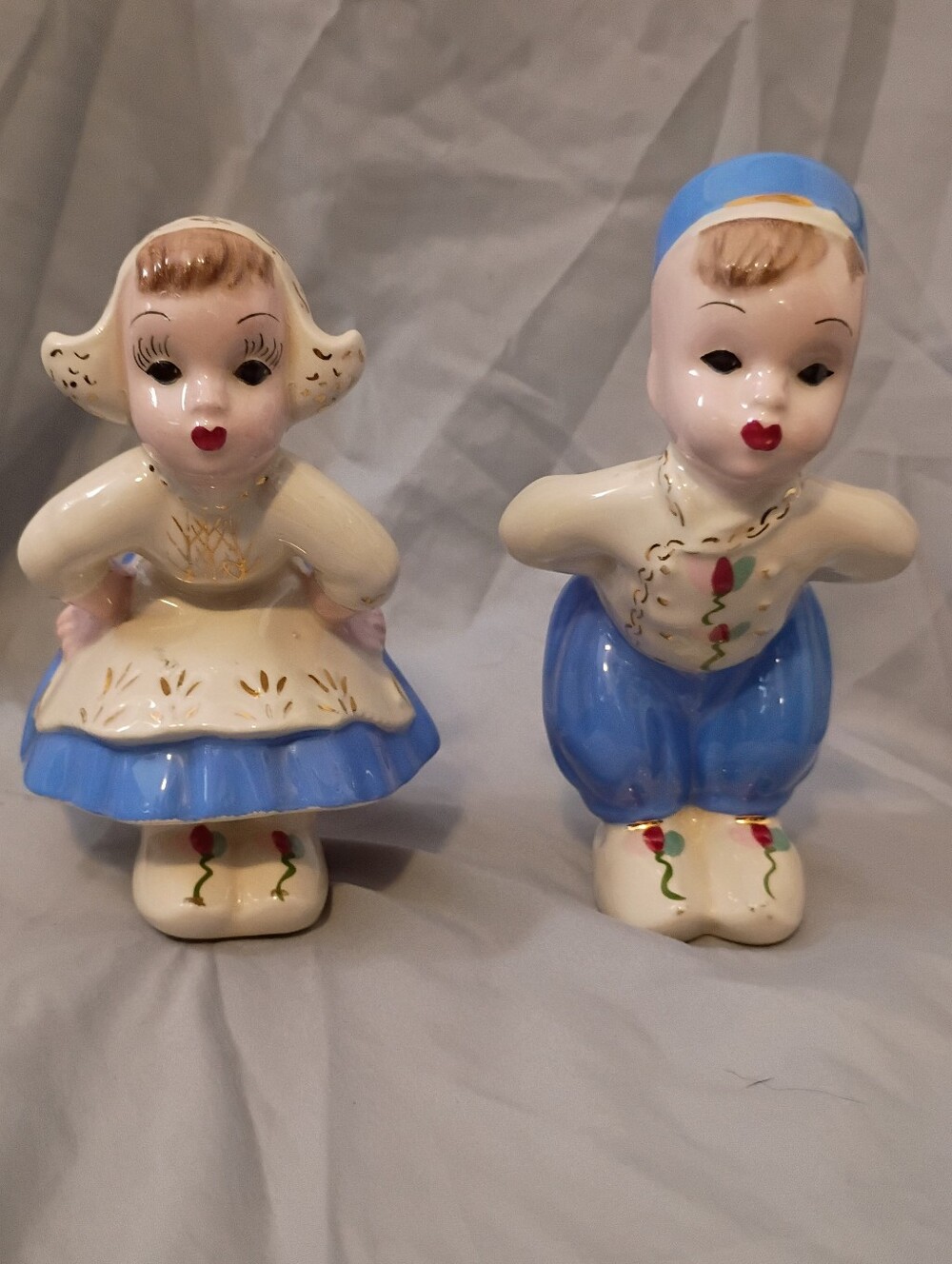 Vintage Dutch boy and girl kissing.   Ceramic glossy.